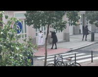 Woman white dress champagne bottle explosion street