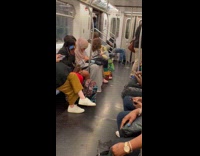 Collab Subway Creatures - Woman in train with baby statue holding a hand