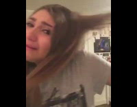 Grey shirt girl cries over tangled hair 