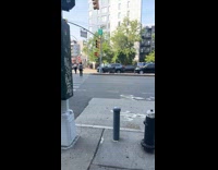 Woman doing bicycle crunches on the street 