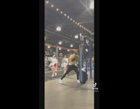 Guy tries to film with punching bag 
