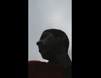 Monkey steal glasses of guy red shirt