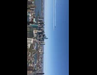 Jet planes fly over city white trail