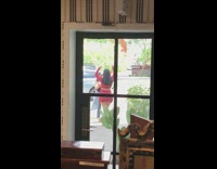 Red shirt skirt girl black glass door 