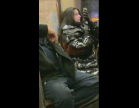 Girl wearing gloves uses nose for phone