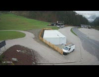 Big boulder rolling down hill lands in road