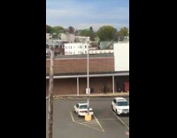 Guy waits for person to ride huge bike 
