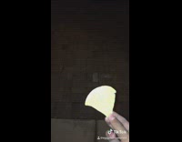 Guy feeds chip to wispy white face