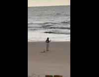 Woman white dress with wine at beach
