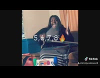 Woman uses couch, kids toy, and crutches and plays drums to Get Ur freak on Missy Elliott