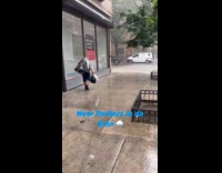 Man use garbage bag as rain cover
