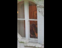 Two women twerks by the building window