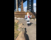 Collab WINY - Person in Pennywise costume struts under bridge