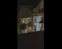 Large shadow of a woman across the building