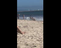 Two bikini girls crawl lay back beach 
