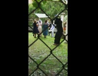 Gorilla monkey costume guy holds wedding bouquet 
