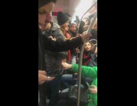 Guy plays guitar and sings Halo by Beyonce with passengers on subway train