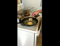 Woman mixing butter in cast iron pan