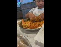 Kid rubs his food in all the sauce