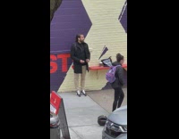 Guy on sidewalk offering joints for instagram follows