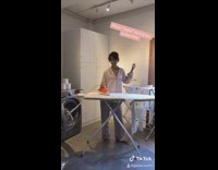 Girl takes bath in large purell container 