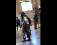 Man Jack Sparrow costume walks inside station