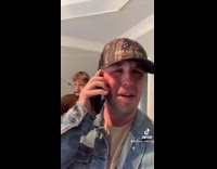 Guy on phone with mom bow arrow 