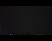 Lightning Strike at nighttime filmed from a window