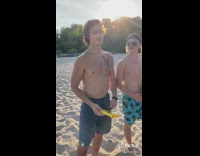 Girl asks people questions microphone beach jersey 