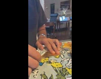 Guy folds gold ferrero rocher wrappers box 