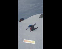 orange beanie blue jacket back flip ski