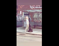 Man with box head waits for bus