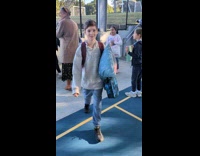 Boy says no to girl hold sign