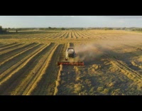 Drone white vehicle harvests cuts crops seagull