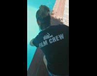 Girl grabs drowning bird out of pool 