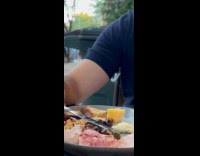 Collab WINY - Man helps bee cut from meat 