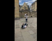 Woman with number 2 and 5 balloon photographer lie down