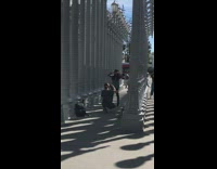 Girl black hat lamp art installation 