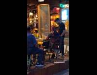 Collab WINY - Deadpool and Wolverine cosplayers drink outside bar