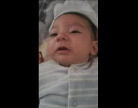 Baby light grey shirt open mouth yawn