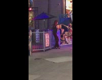 girl leans against carnival ride