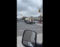 Car flipped upside down middle of street
