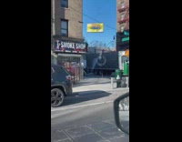 Guy pretends to be a movie character in outfit and gun 