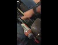 Guy showcasing poor design of cup holder