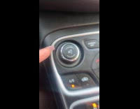 Woman mistaking gear knob for volume control