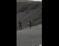 Collab IITW - A couple next to volcano jumping picture