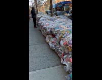 Long pile of collected cans in plastic