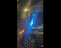 Woman drives with a camera setup on the car hood