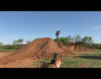 Guy attempts to jump double dirt ramp 