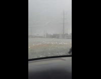 Guy surges through flood with his car 